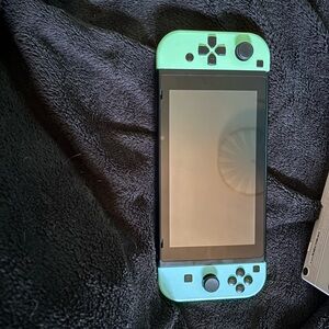 Nintendo Handheld Console Green and Blue Sleek Design